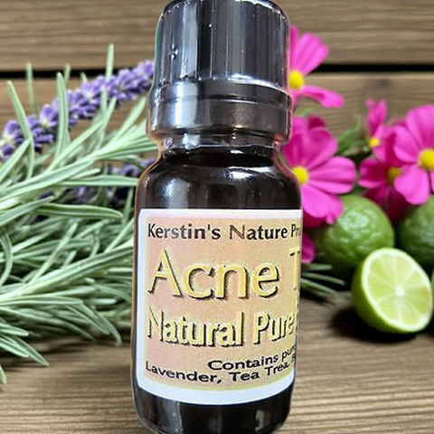 Bottle of Kerstin's Nature Pure Acne Natural Pure essential oil with lavender, tea tree, rose geranium and lime on a wooden background