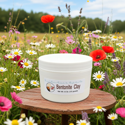 Bentonite Clay container on a wooden stool in a field of wildflowers
